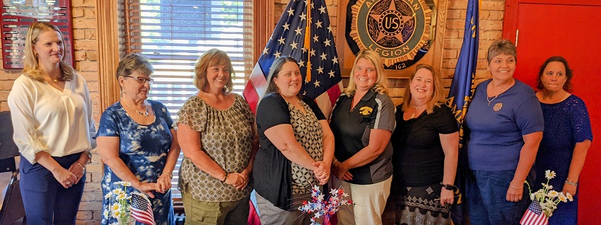 A group of women posing for a photo

Description automatically generated with medium confidence