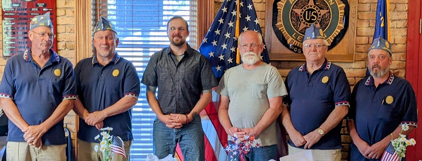 A group of men posing for a photo

Description automatically generated with medium confidence