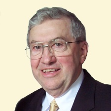 A person wearing glasses and a suit

Description automatically generated with medium confidence