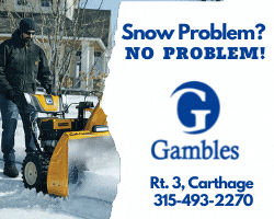A person standing next to a snow plow

Description automatically generated with low confidence