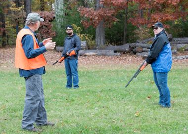 hunters stand in field during education course