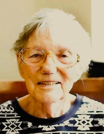 An old person with glasses smiling

Description automatically generated