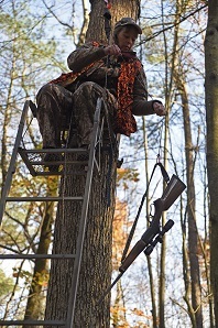 Hunter in Tree Stand with Safety Gear