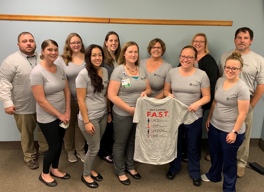 A group of women wearing matching outfits

Description automatically generated