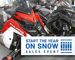 A group of snowmobiles in a row

Description automatically generated