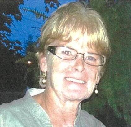 A person wearing glasses and smiling at the camera

Description automatically generated