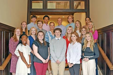 A group of people posing for a photo

Description automatically generated