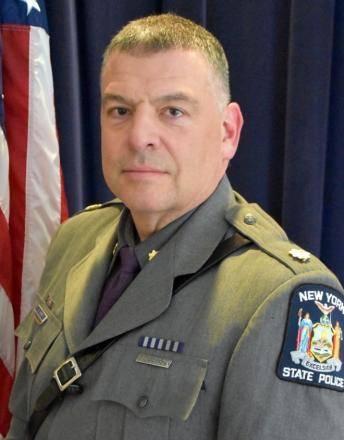 A person in a uniform

Description automatically generated