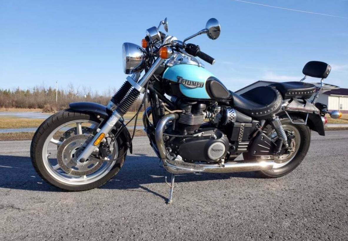 A motorcycle parked on the side of the road

Description automatically generated