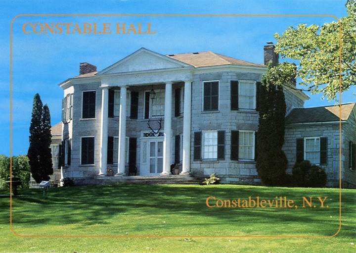 A large white house with columns

Description automatically generated