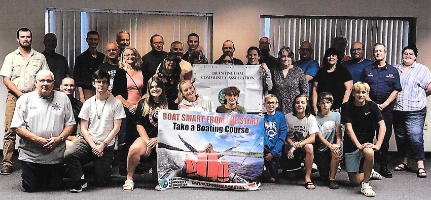 A group of people posing for a photo

Description automatically generated