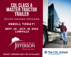 A person standing next to a truck

Description automatically generated