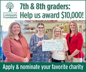 A group of women holding a check

Description automatically generated