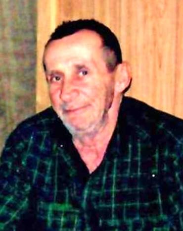 A person in a green plaid shirt

Description automatically generated