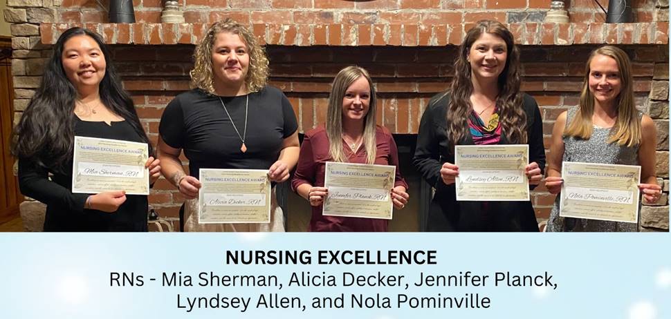 A group of women holding certificates

Description automatically generated