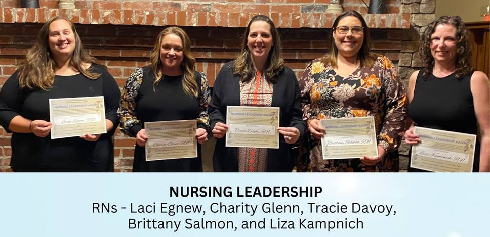 A group of women holding certificates

Description automatically generated
