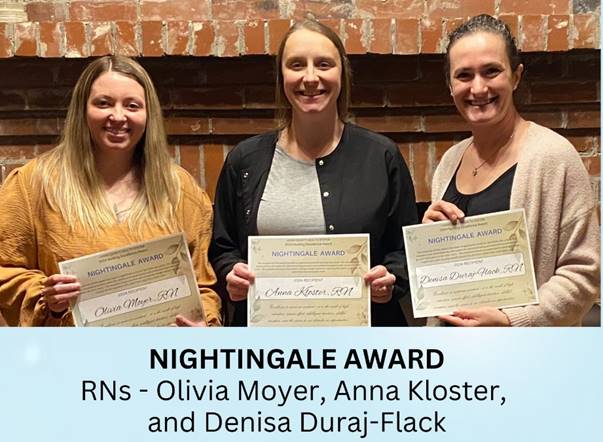 A group of women holding certificates

Description automatically generated
