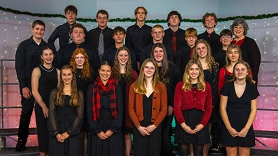 A group of people posing for a photo
Description automatically generated