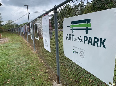 A fence with signs on it

AI-generated content may be incorrect.