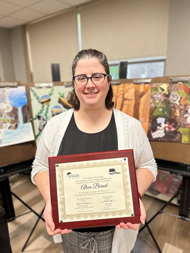 A person holding a certificate
AI-generated content may be incorrect.