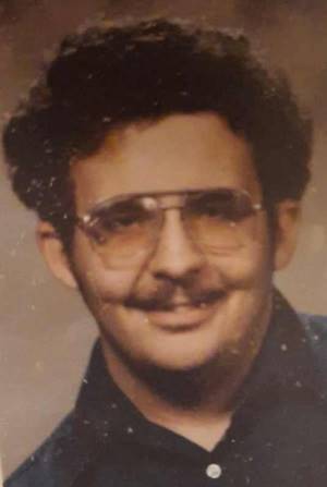 A person with a mustache and glasses

AI-generated content may be incorrect.