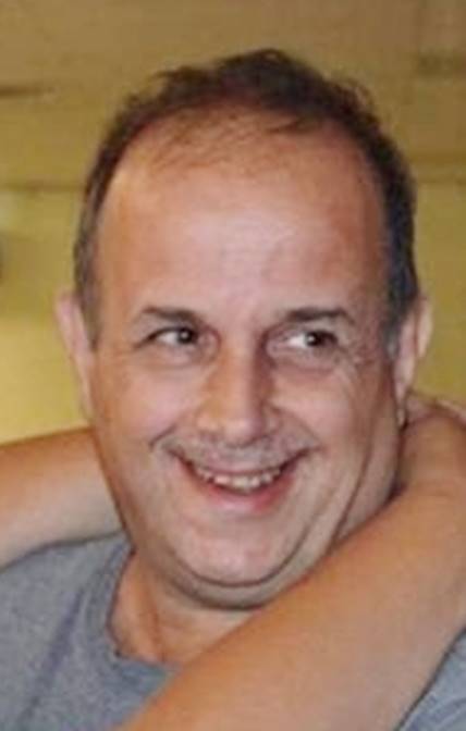 A person smiling with his arms around his neck

AI-generated content may be incorrect.