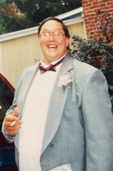 A person in a suit and bow tie

AI-generated content may be incorrect.