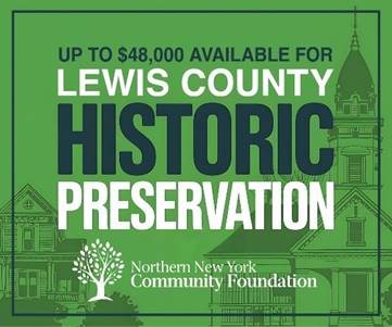 A green and white sign with buildings and trees

AI-generated content may be incorrect.