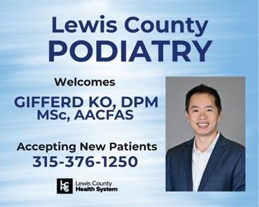 A person in a suit and white shirt

AI-generated content may be incorrect.