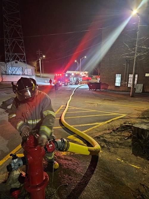 A firefighter holding a fire hydrant

AI-generated content may be incorrect.