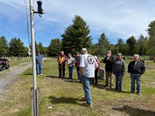 A group of people standing in a field

AI-generated content may be incorrect.