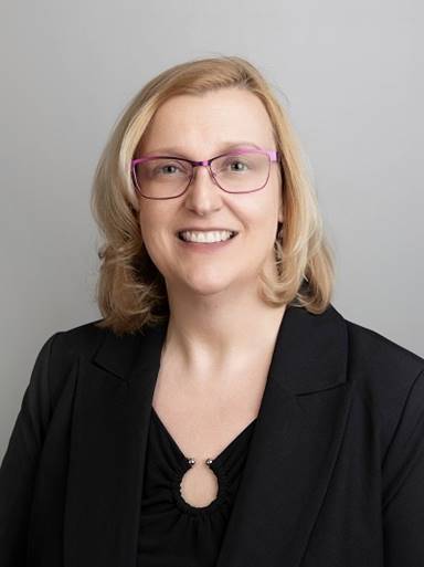 A person wearing glasses and a black jacket

AI-generated content may be incorrect.