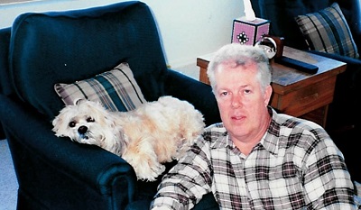 A person sitting in a chair with a dog

AI-generated content may be incorrect.