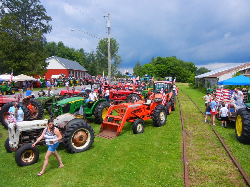 A group of tractors parked on a train track

AI-generated content may be incorrect.
