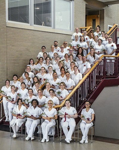 A group of people in white outfits sitting on stairs

AI-generated content may be incorrect.