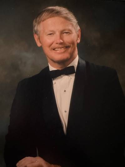 A person in a tuxedo smiling

AI-generated content may be incorrect.