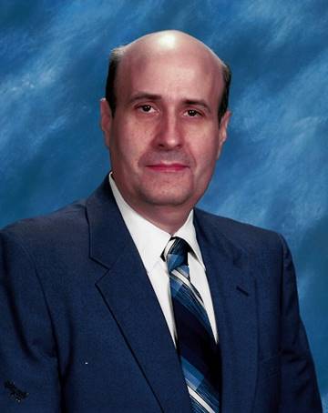 A person in a suit and tie

AI-generated content may be incorrect.