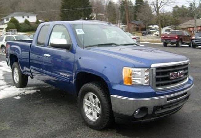 A blue pickup truck parked in a parking lot

Description automatically generated with medium confidence